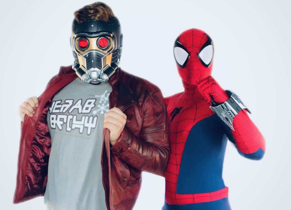Masked galaxy outlaw and spider hero characters together