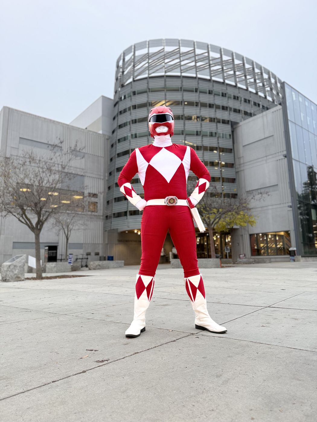 Red ranger hero character standing tall outdoors